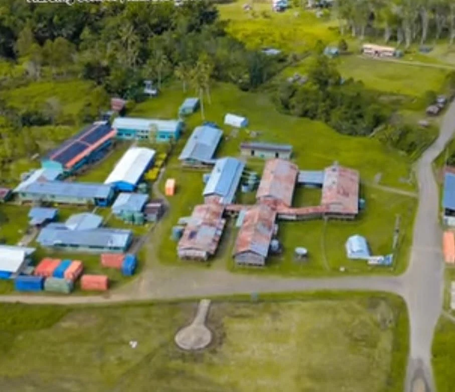 An aerial view of Rumginae Rural Hospital highlights the facility at the heart of its surrounding rural community. The image